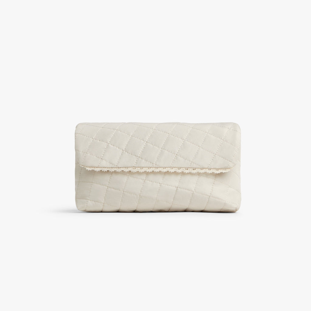 Cream | Front view of Monos x Reformation cosmetic pouch in cream