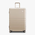 Champagne Gold | Front view of Aluminum Check-In Large in Champagne Gold