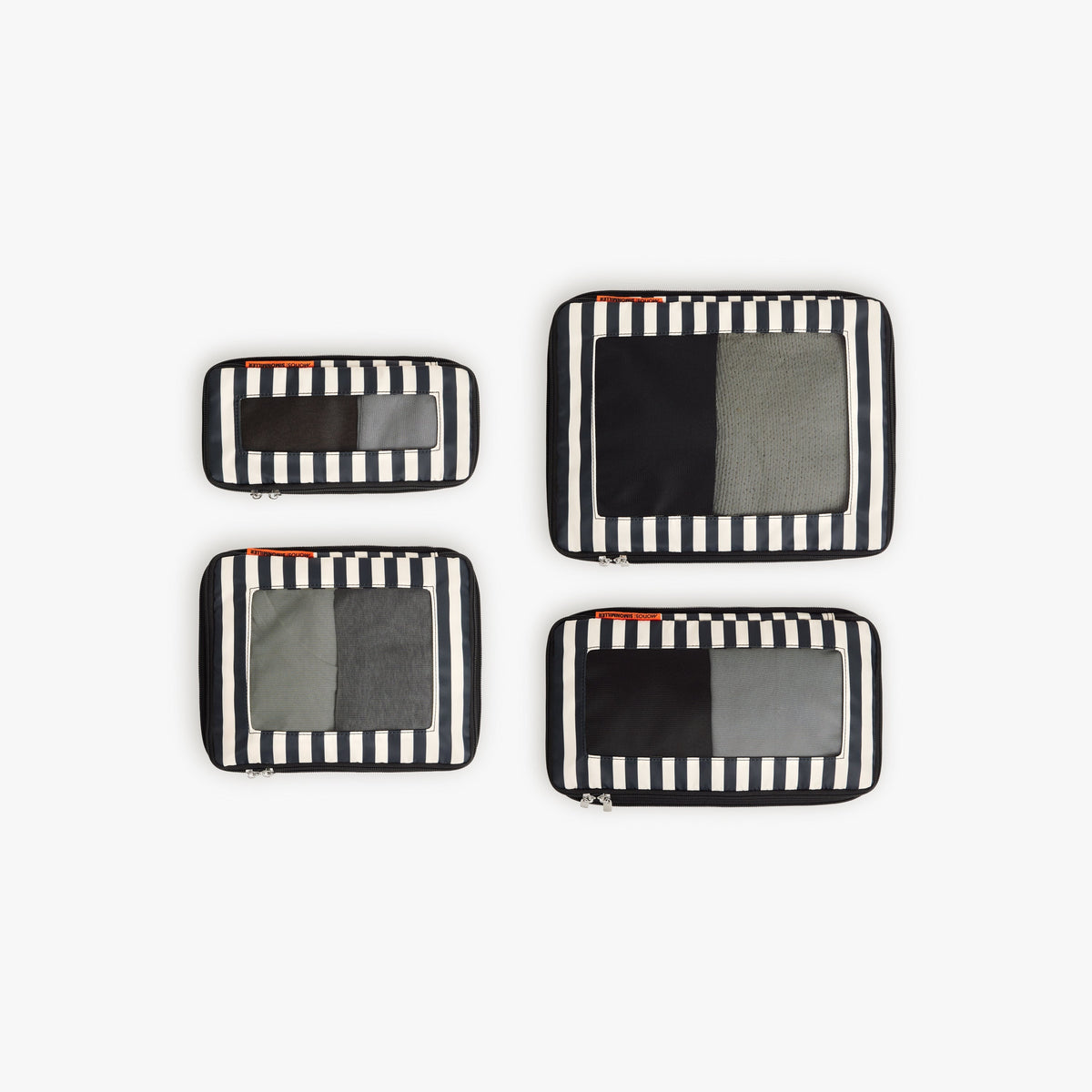 Set of Four / Poplin Stripe Black | Set of four Poplin Stripe Black compressible packing cubes arranged flat to show all sizes